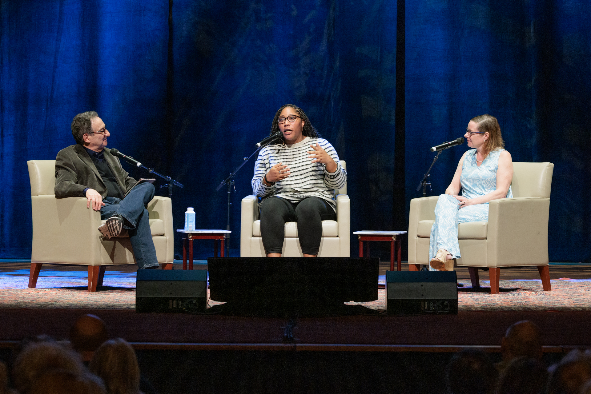 “Science Friday” host Ira Flatow (l), Imani Black and Tara Scully onstage during the recording of 'Science Friday.'