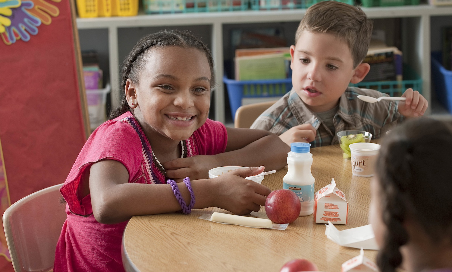 Equity Eats children eating school meals in classroom