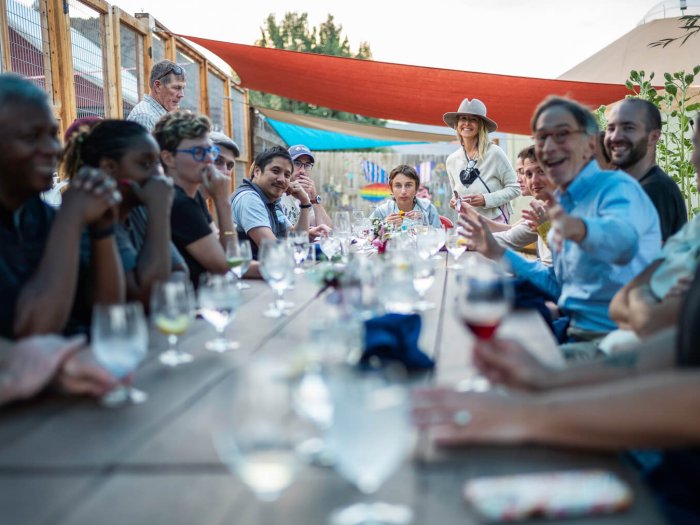 attendees at the Aspen Seminar 2025 gather around the table