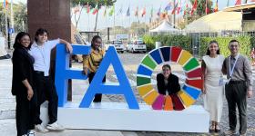 Photo of six students with FAO sign