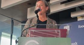 Stacy Dean at a podium at Climate Week NYC